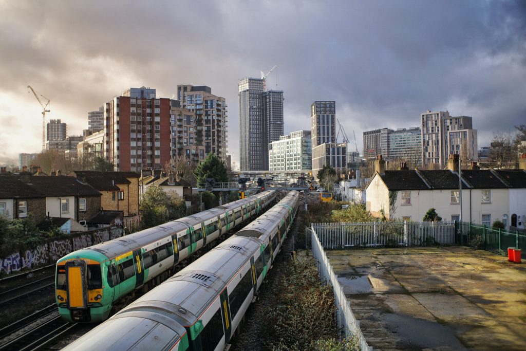 Train with highrise buildings in the background -South East London