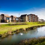 Oakgrove Village new homes with river in the front