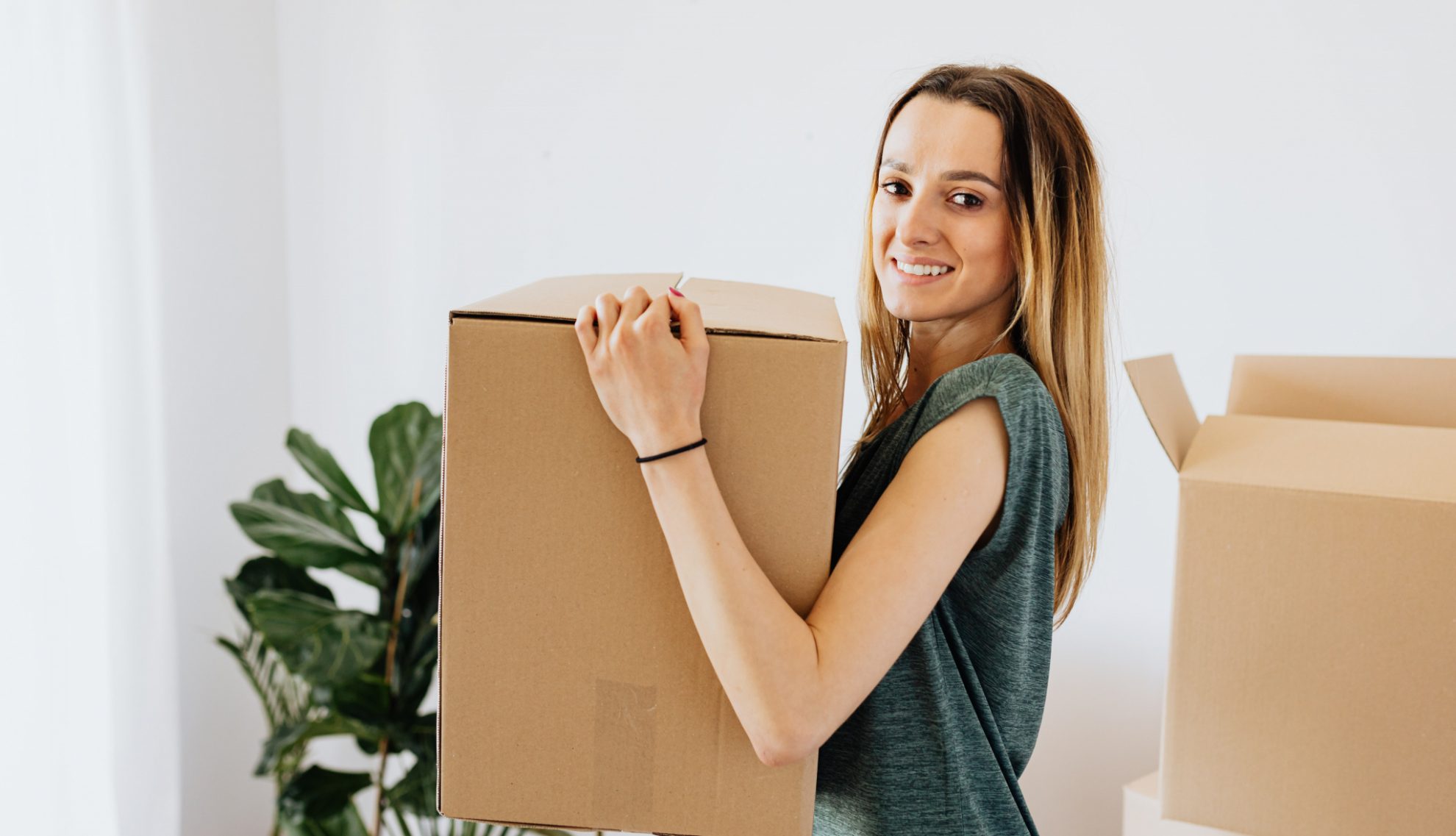 Removal costs UK - woman moving house