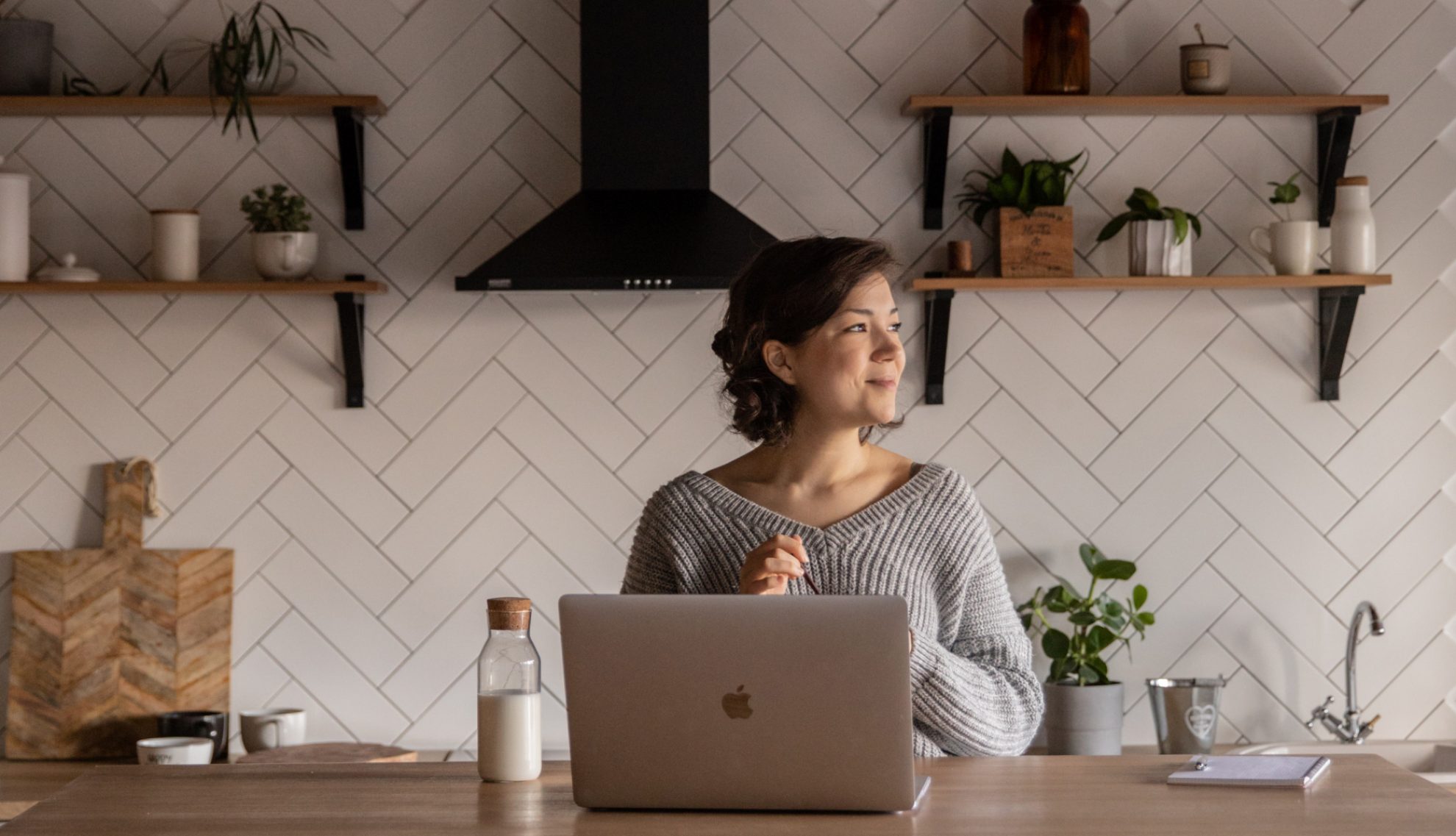 Girl working on her laptop in her student accommodation in London