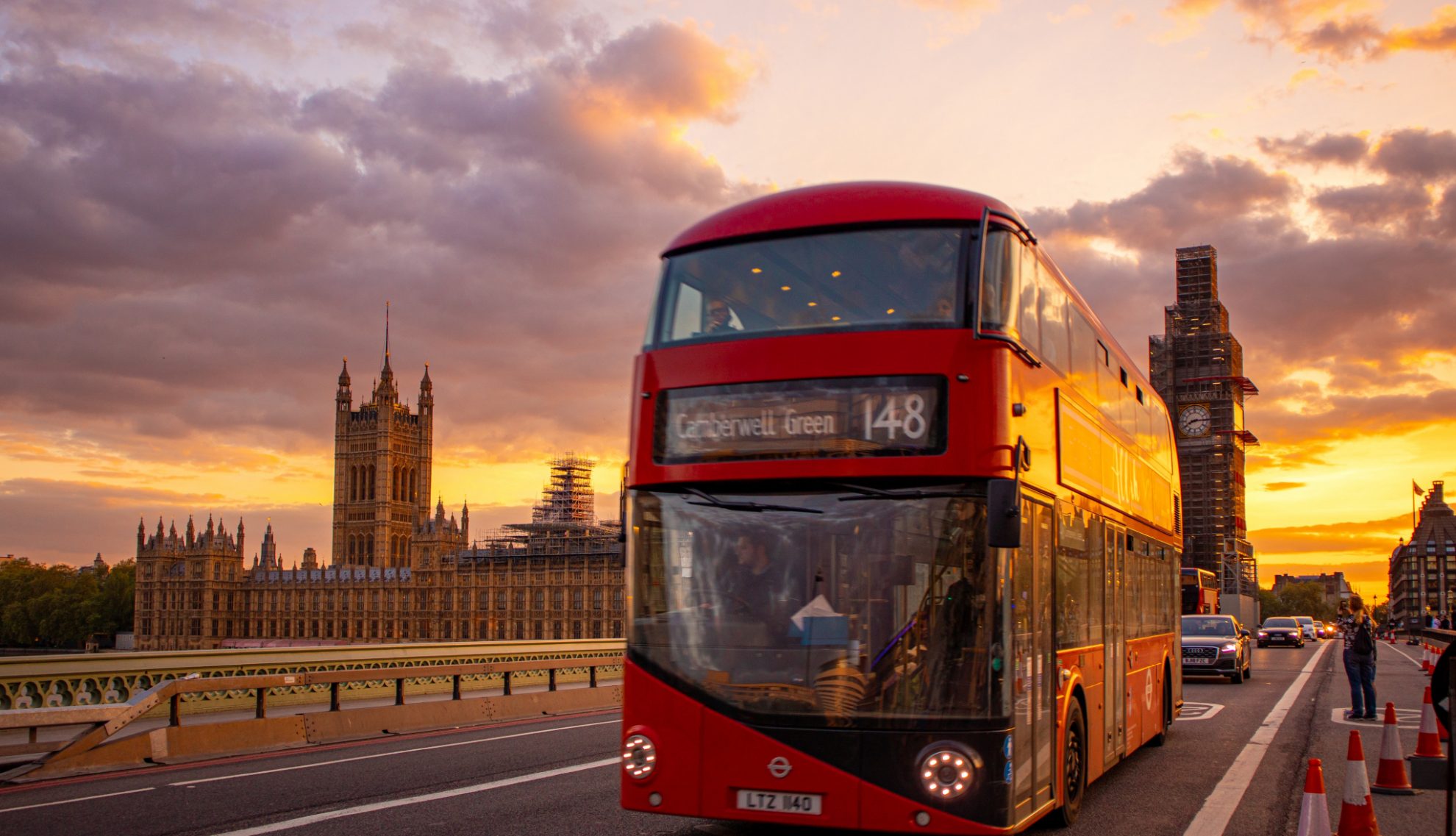 Central London, with a red bus in front of the Palace of Westminster
