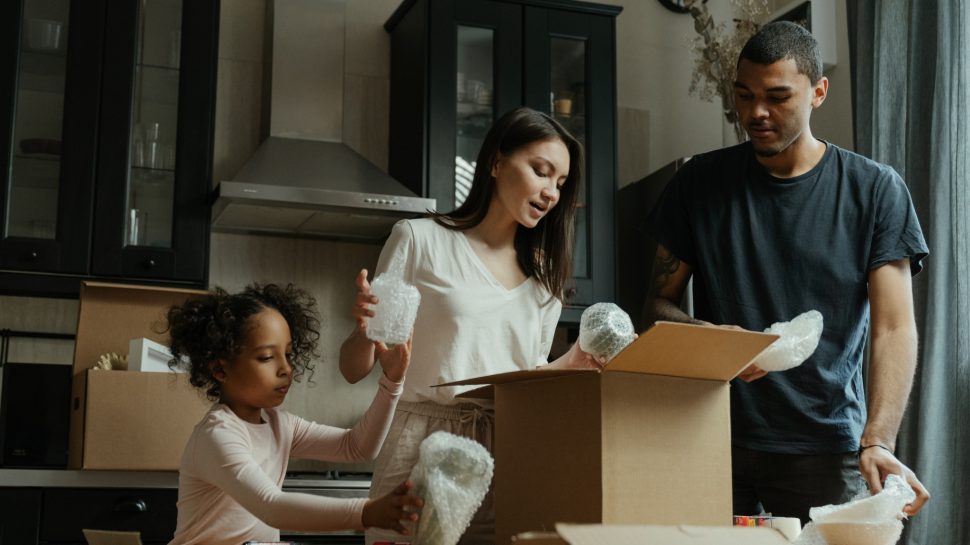 Family moving into First Homes Scheme property