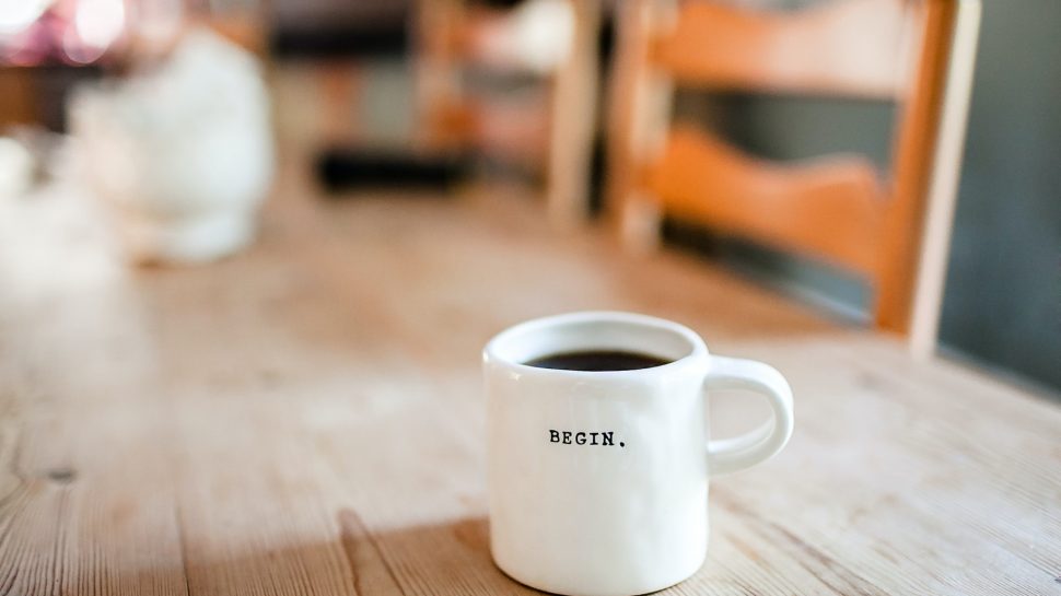 Cup of coffee on table in new home
