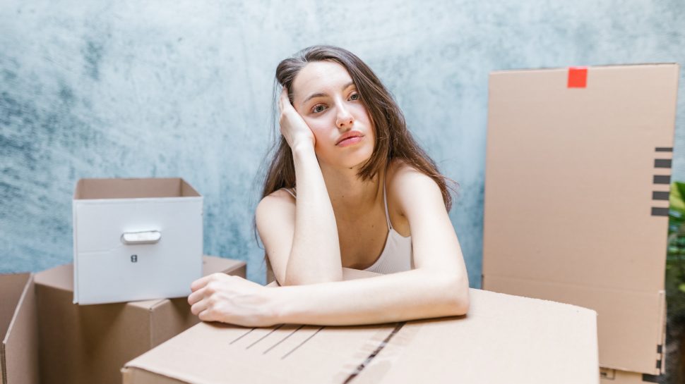 Woman with packing boxes.