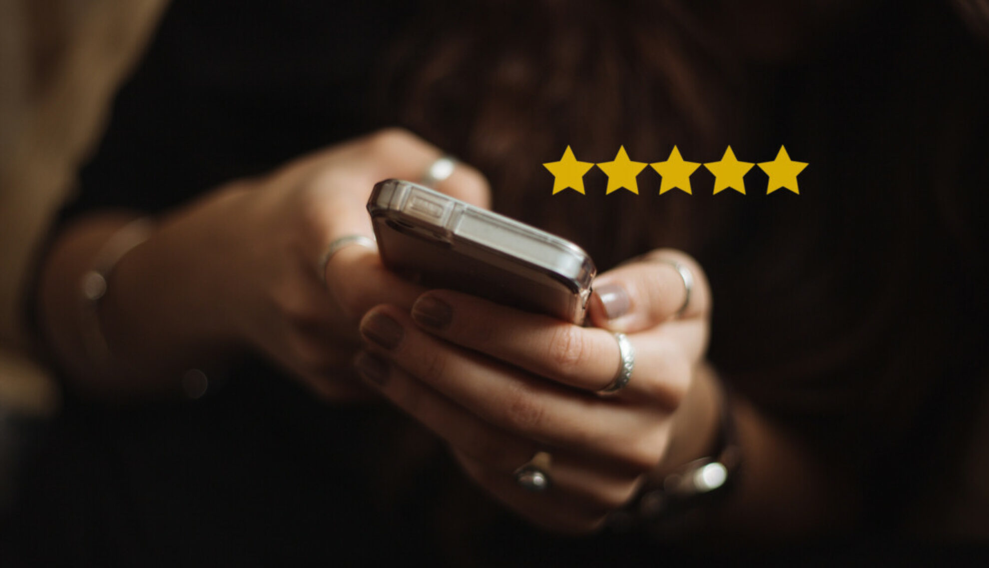 Woman using a mobile phone on a reviews website