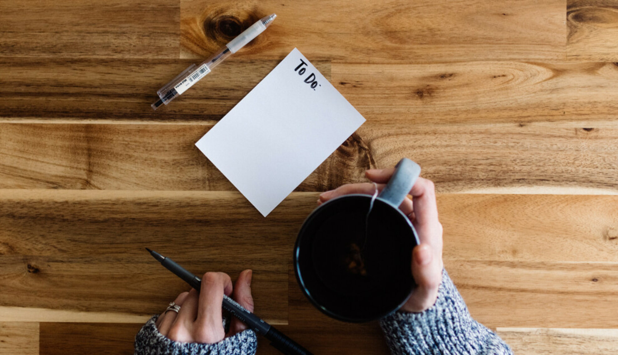 Woman writing a change of address checklist