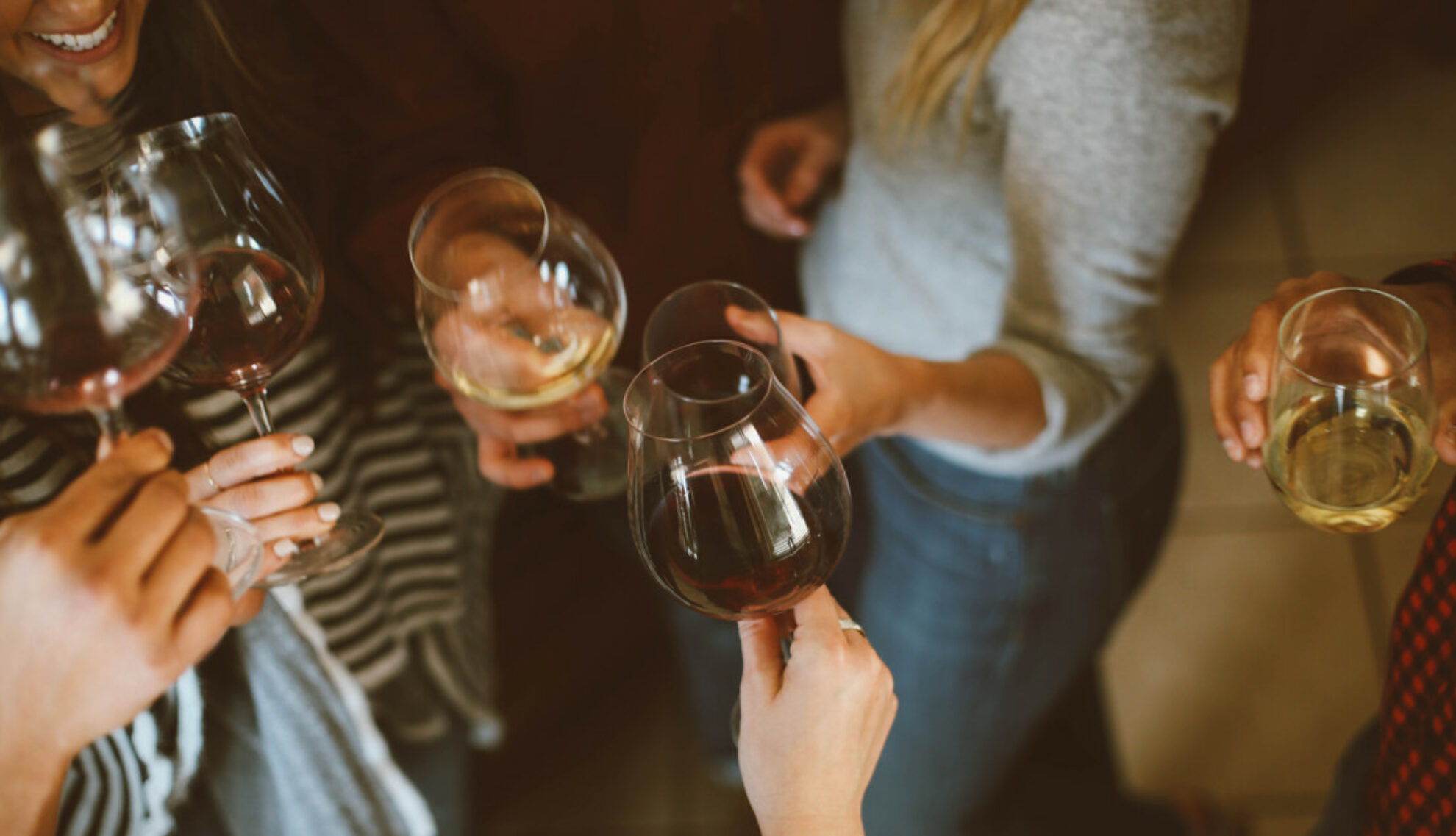 Group of flatmates enjoying wine together