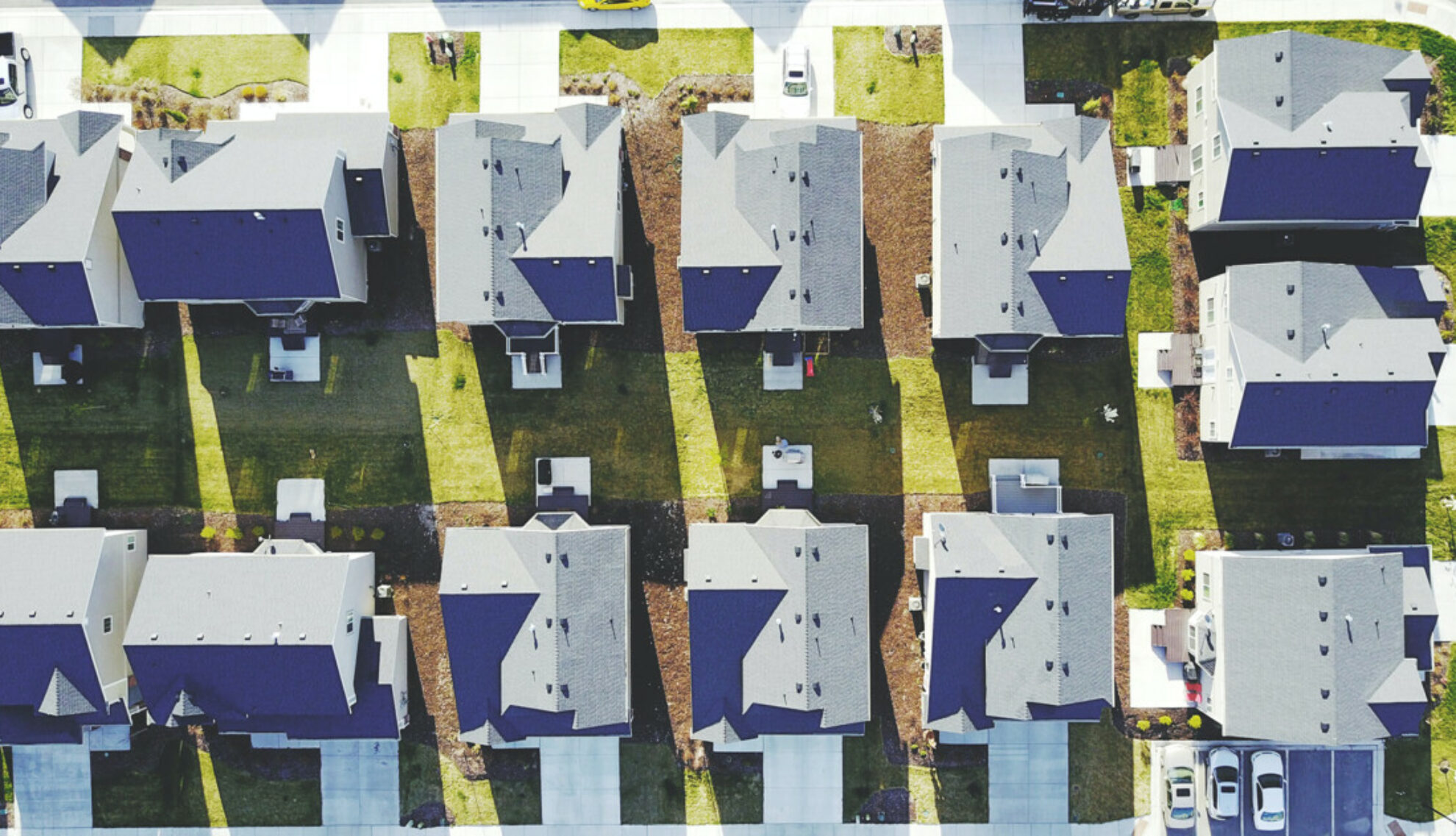 Aerial shot of detached houses with gardens